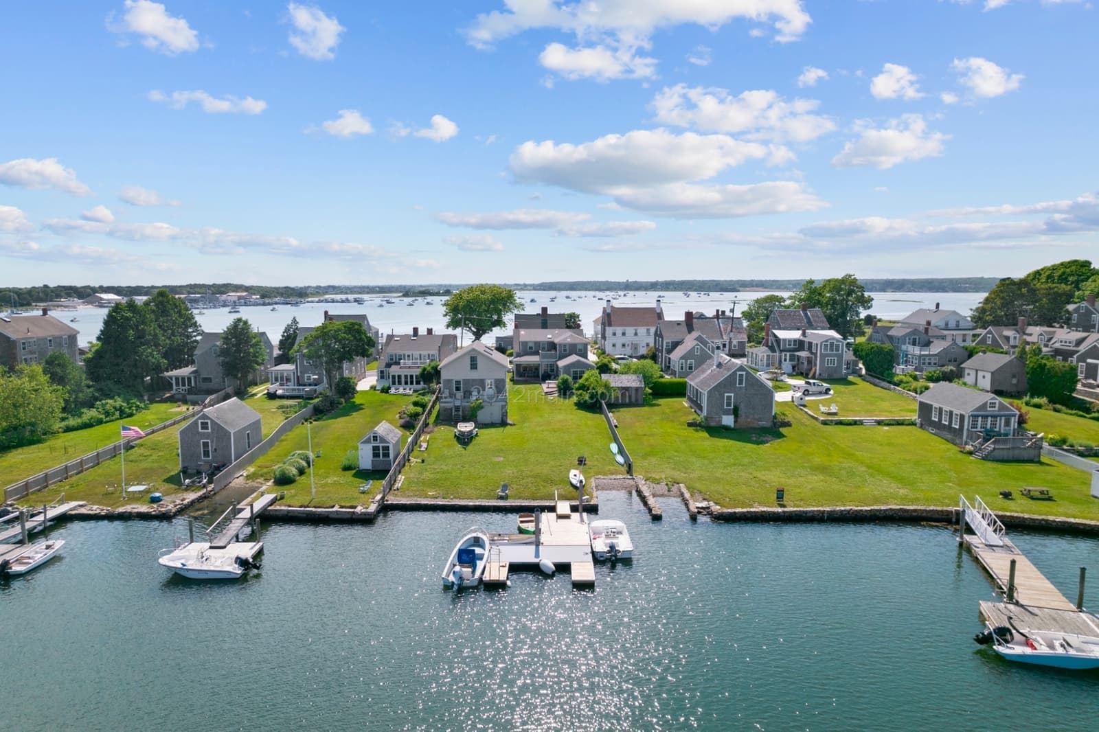 Waterfront backyards with docks and boats on moorings at Westport Point