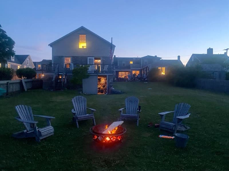 Fire pit at dusk overlooking the harbor, Westport Point