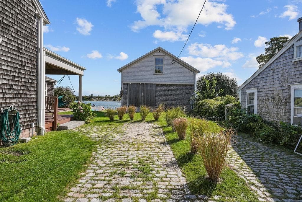 Cobblestone path and boathouse at Westport Point