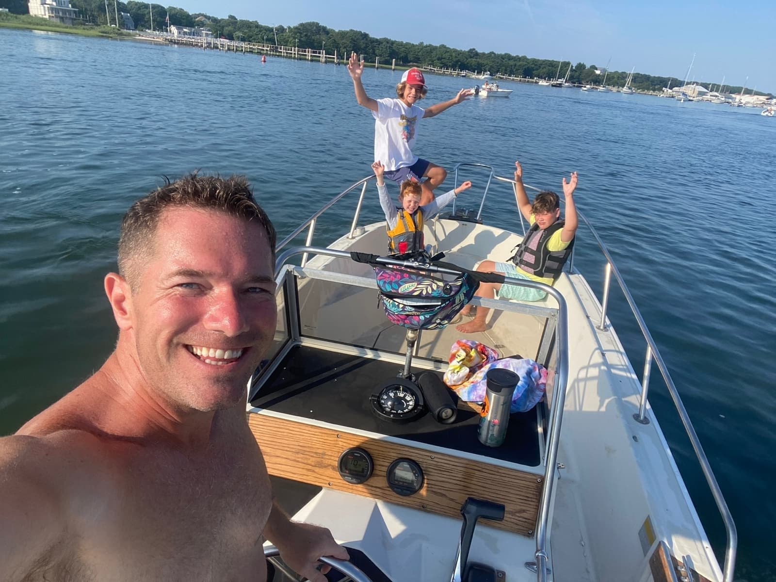 Family heading out by boat from Westport Point harbor